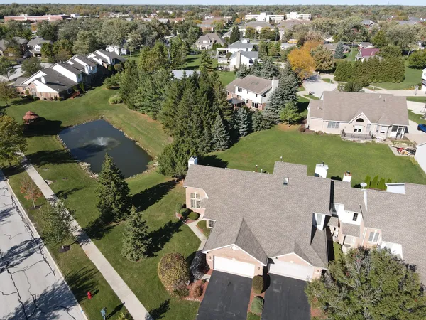 an aerial view of residential houses with outdoor space