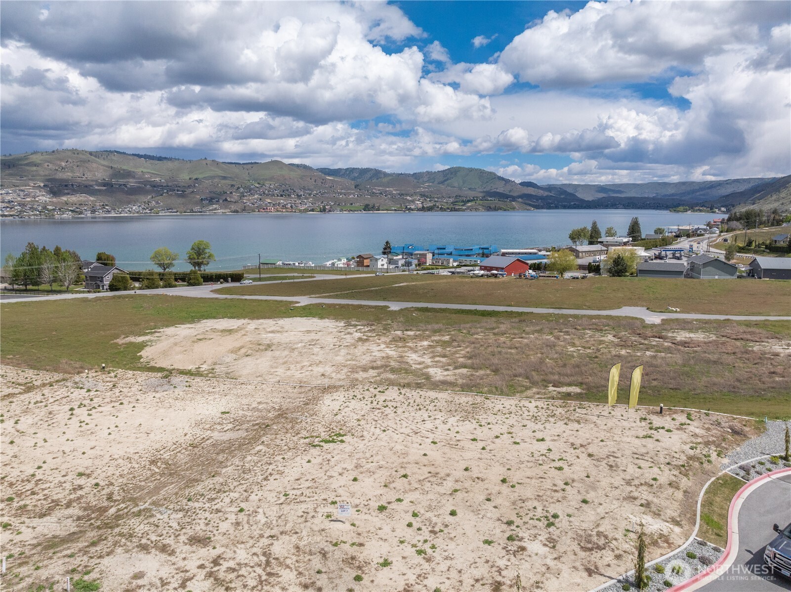 97 Loretta Lane Chelan, WA 98816 - Photo 30 of 30 a view of a lake with houses in the back