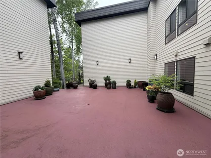 a view of a street with potted plants
