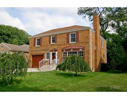 470 Uvedale Road Riverside, IL 60546 - Photo 1 of 12 a front view of a house with a garden