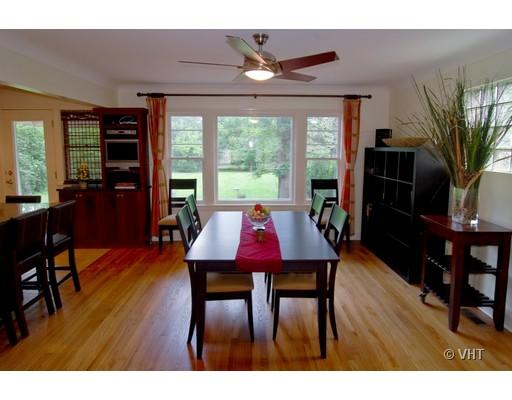 470 Uvedale Road Riverside, IL 60546 - Photo 5 of 12 a view of a dining room with furniture window and wooden floor