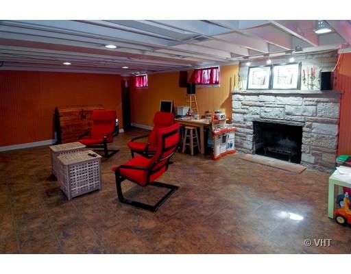470 Uvedale Road Riverside, IL 60546 - Photo 6 of 12 a living room with furniture a flat screen tv and a fireplace