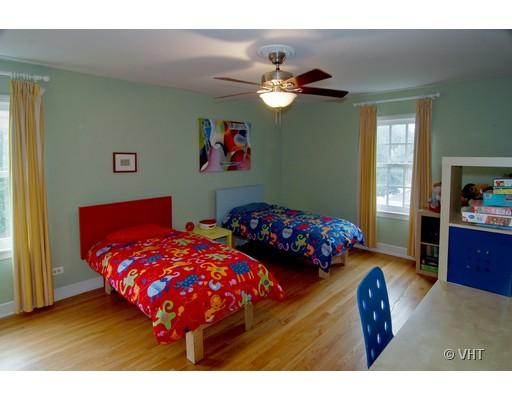 470 Uvedale Road Riverside, IL 60546 - Photo 9 of 12 a bedroom with two beds and a chandelier