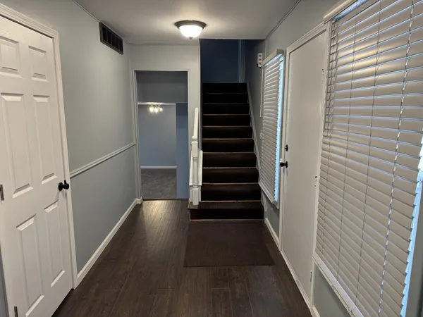 a view of entryway with wooden floor