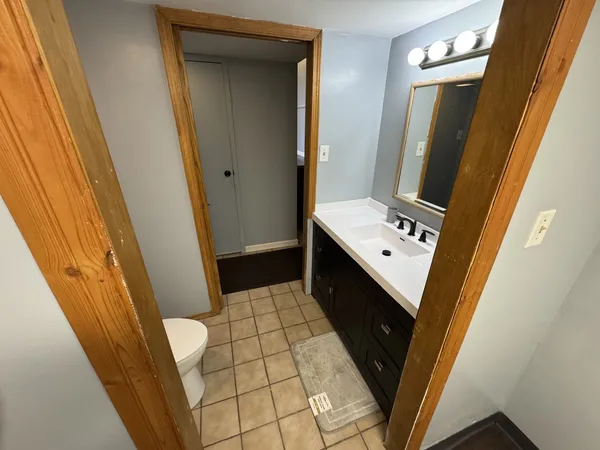a bathroom with sink and mirror