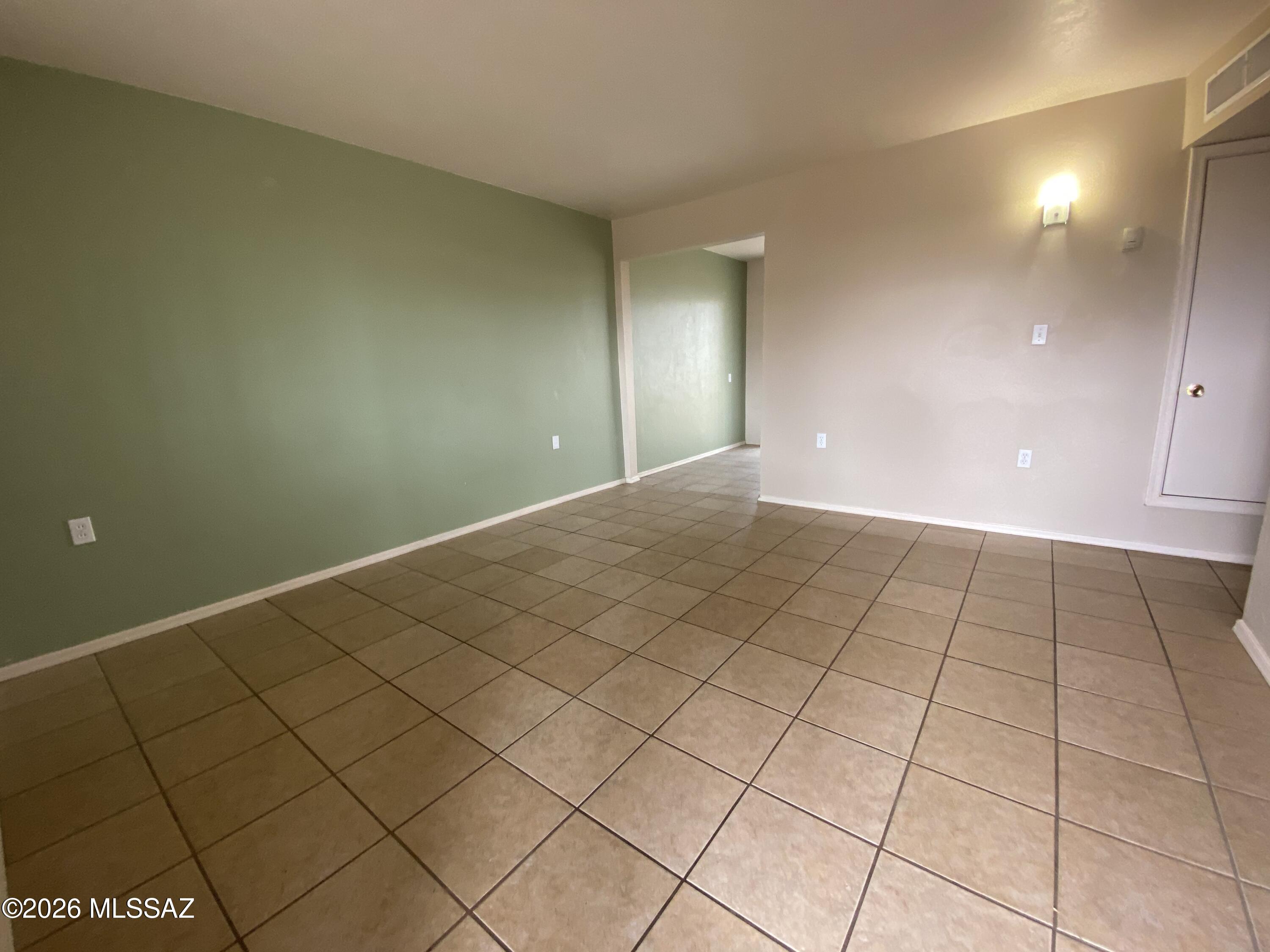 350 North Silverbell Road, Unit 94 Tucson, AZ 85745 - Photo 2 of 15 a view of an empty room and window