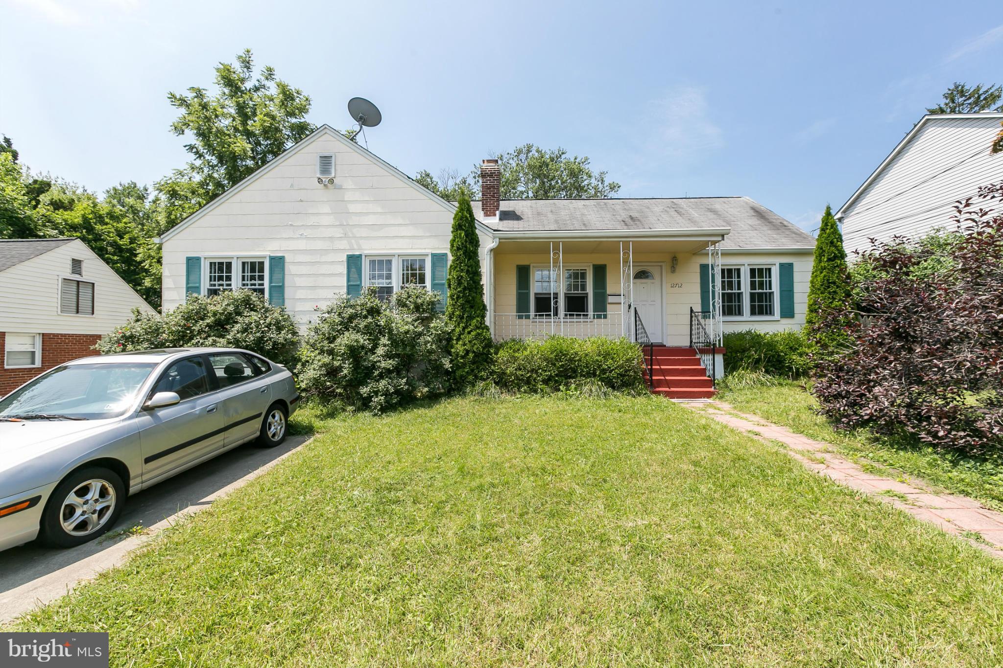 12712 Flack Street Silver Spring, MD 20906 - Photo 1 of 28 a view of a house with a garden and plants