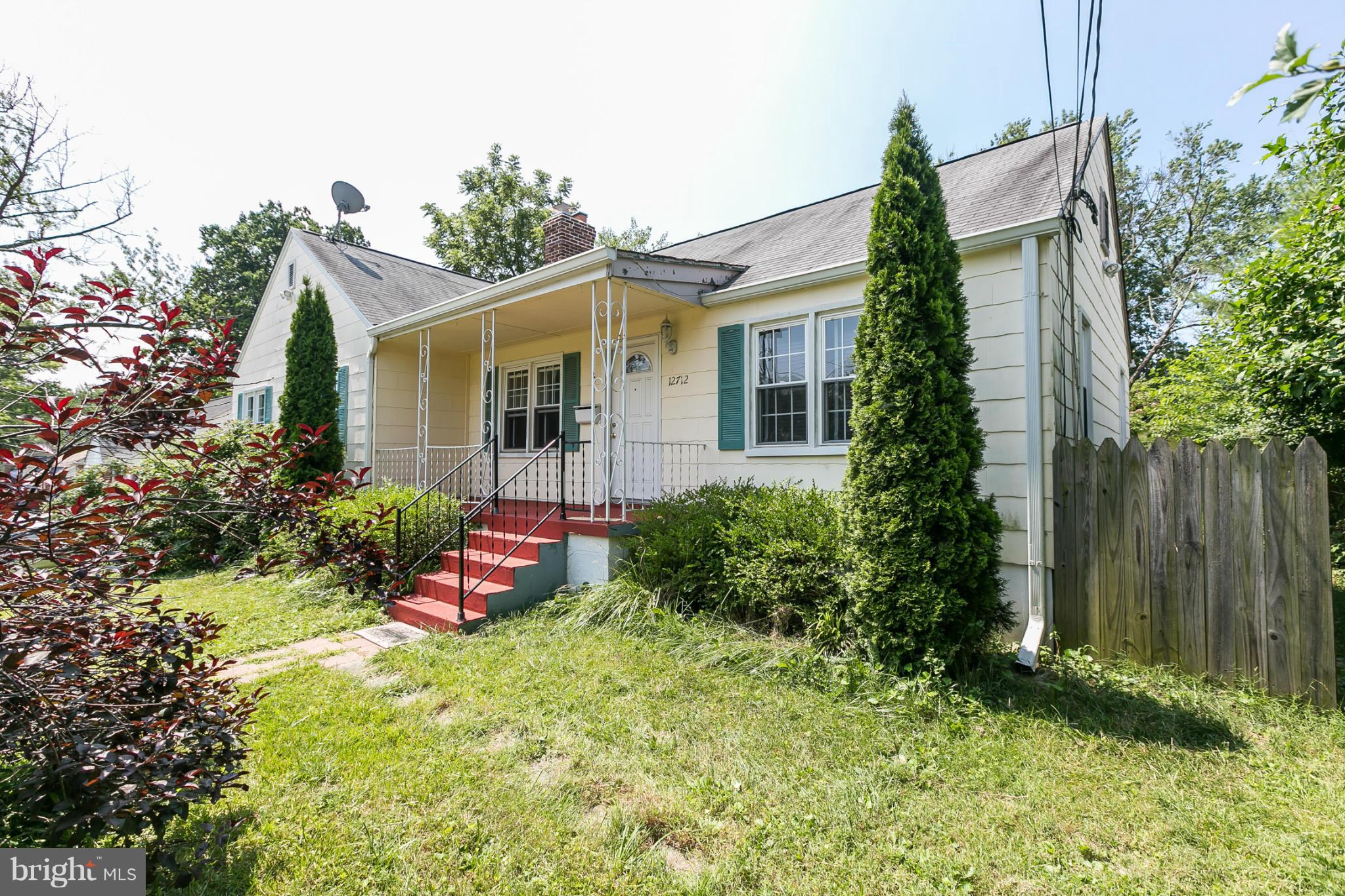 12712 Flack Street Silver Spring, MD 20906 - Photo 2 of 28 a view of a house with a yard and garden