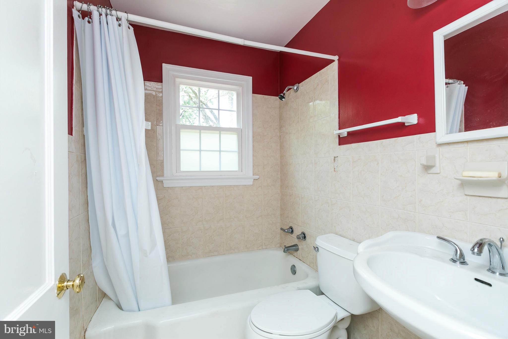 12712 Flack Street Silver Spring, MD 20906 - Photo 13 of 28 a bathroom with a sink toilet and bathtub