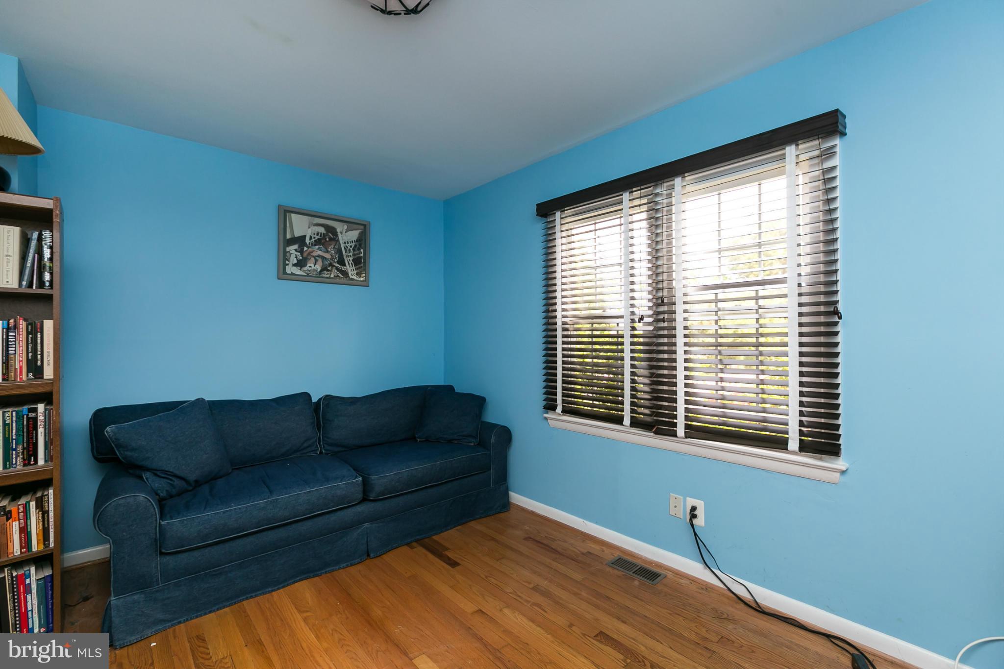 12712 Flack Street Silver Spring, MD 20906 - Photo 14 of 28 a living room with furniture and a window
