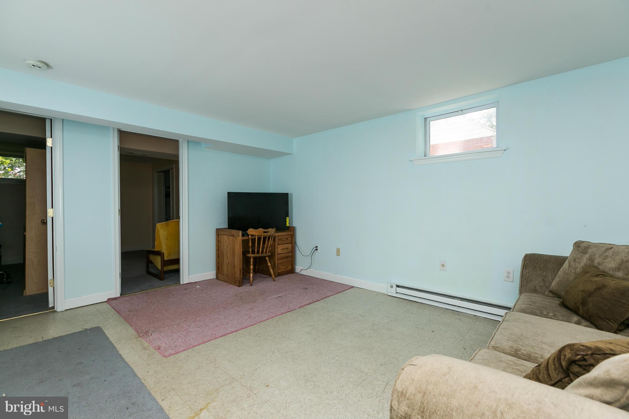 12712 Flack Street Silver Spring, MD 20906 - Photo 22 of 28 a bedroom with a bed and a television
