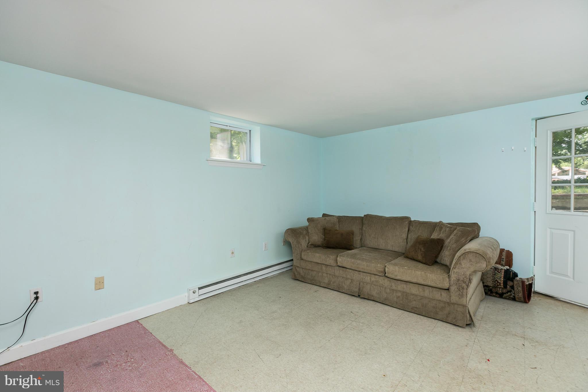 12712 Flack Street Silver Spring, MD 20906 - Photo 23 of 28 a living room with furniture and a couch