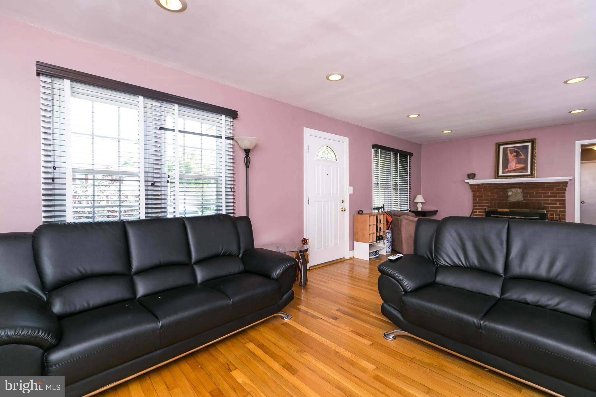 12712 Flack Street Silver Spring, MD 20906 - Photo 5 of 28 a living room with furniture and a couch
