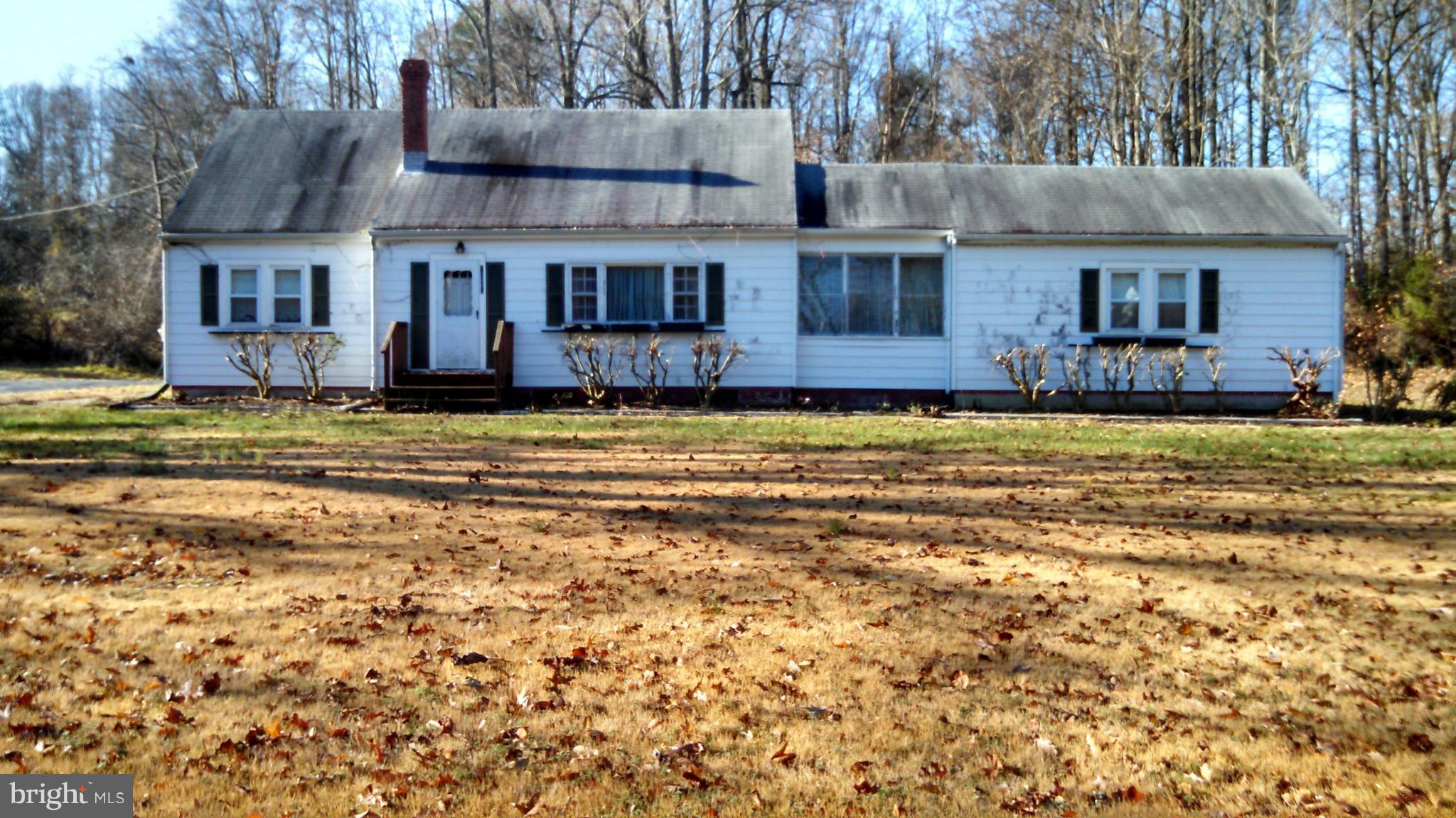 12065 Rousby Hall Road Lusby, MD 20657 - Photo 1 of 1 a house that has a large pool in front of it