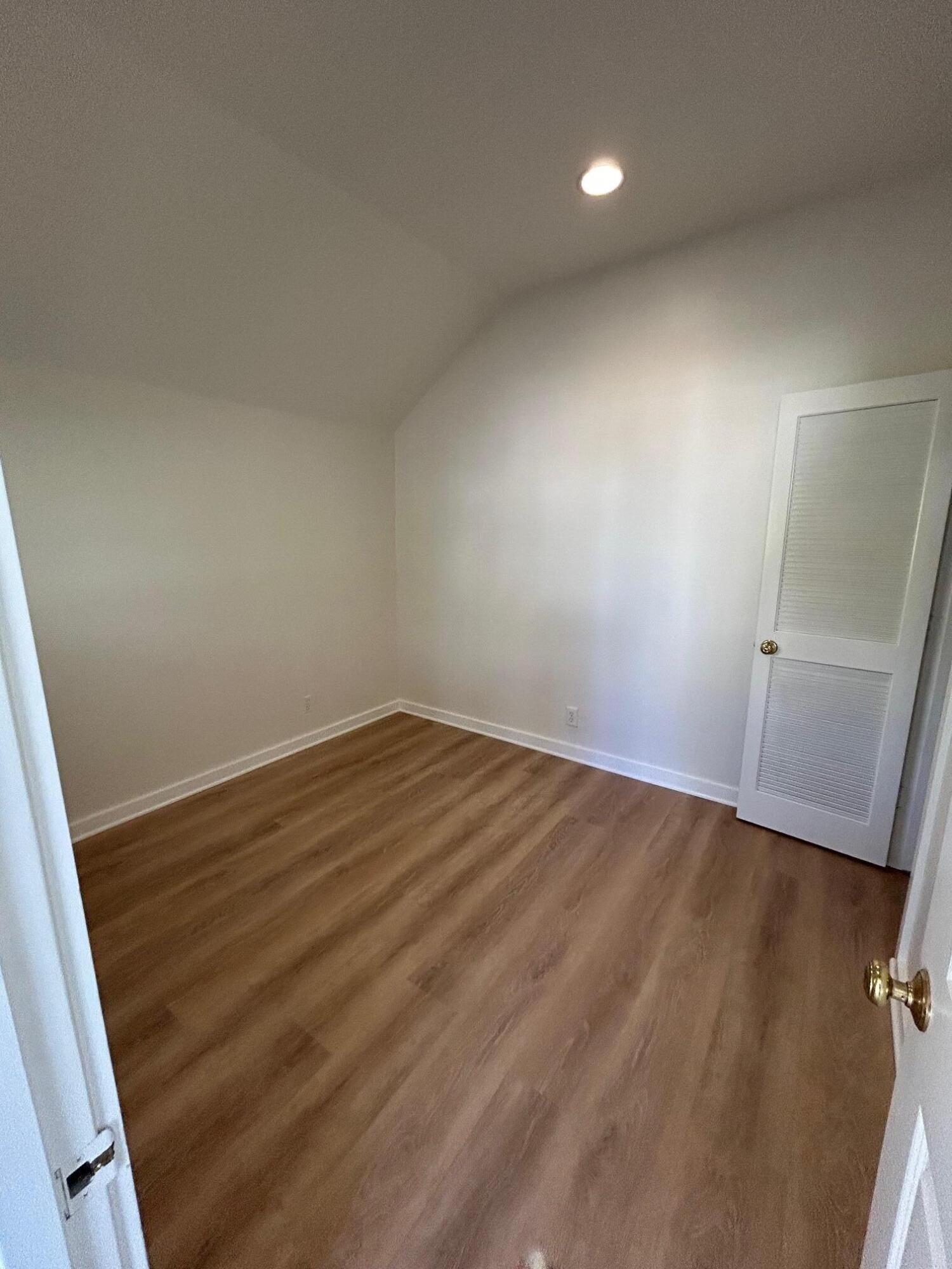 810 East Canon Perdido Street, Unit A Santa Barbara, CA 93103 - Photo 7 of 12 wooden floor in an empty room