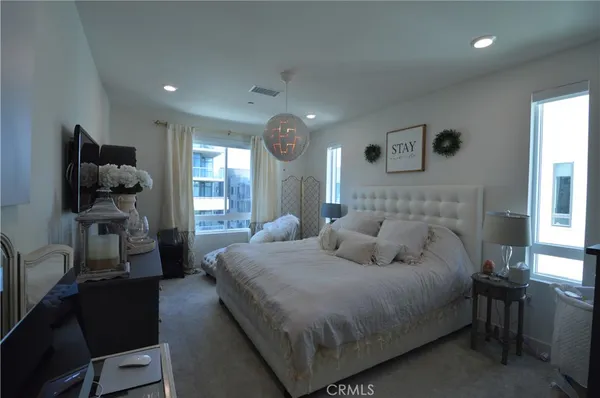 a bedroom with bed and window