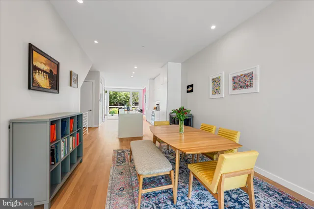 a view of a livingroom with furniture and a bookshelf