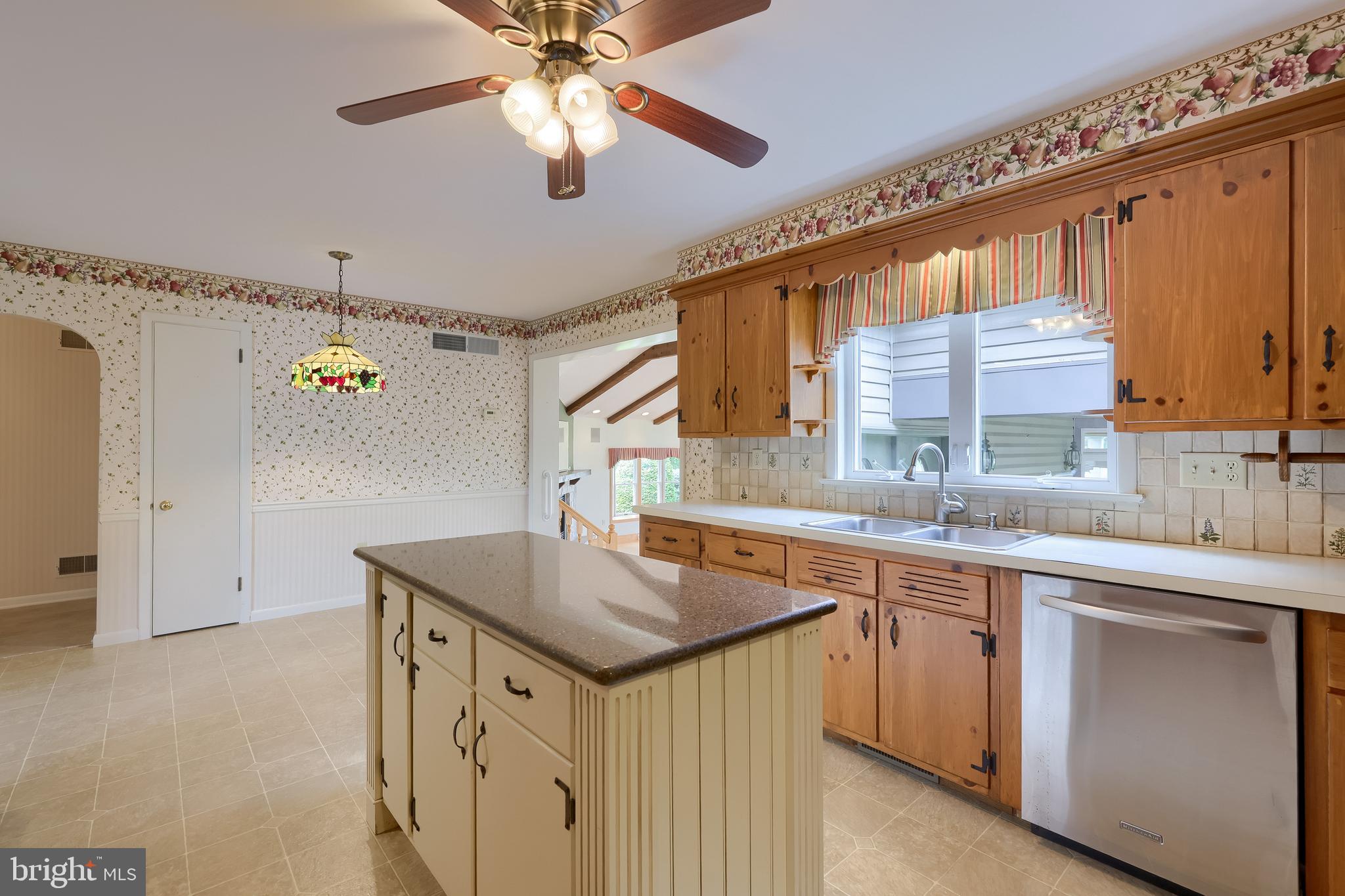 210 Stevens Road Stevens, PA 17578 - Photo 13 of 89 a kitchen with a sink a center island cabinets and a window