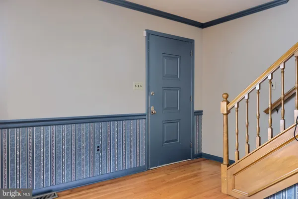 a spacious bedroom with a bed couch and a window