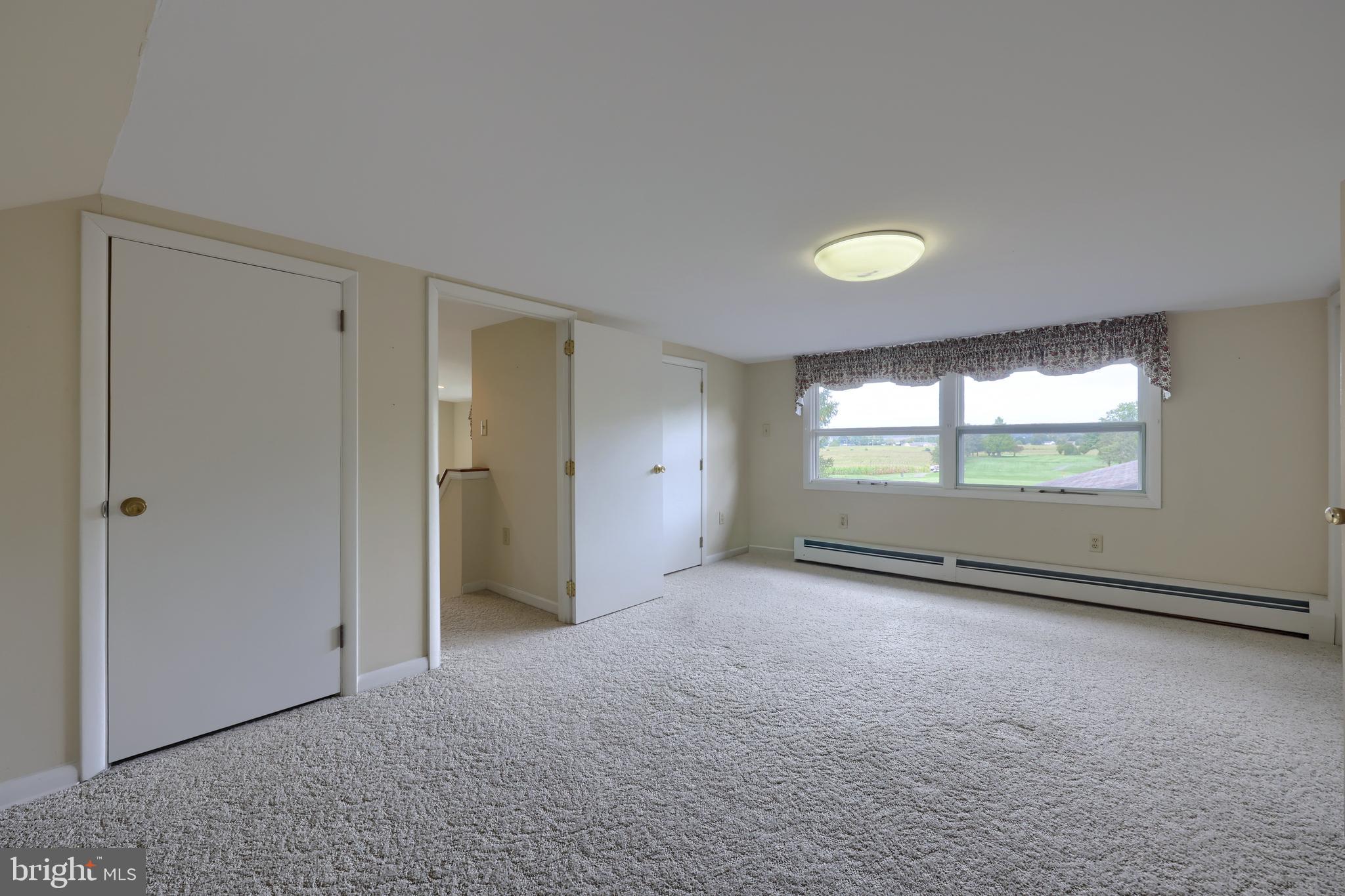 210 Stevens Road Stevens, PA 17578 - Photo 50 of 89 a view of an empty room with a window