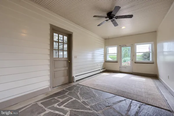 a view of an empty room with a window