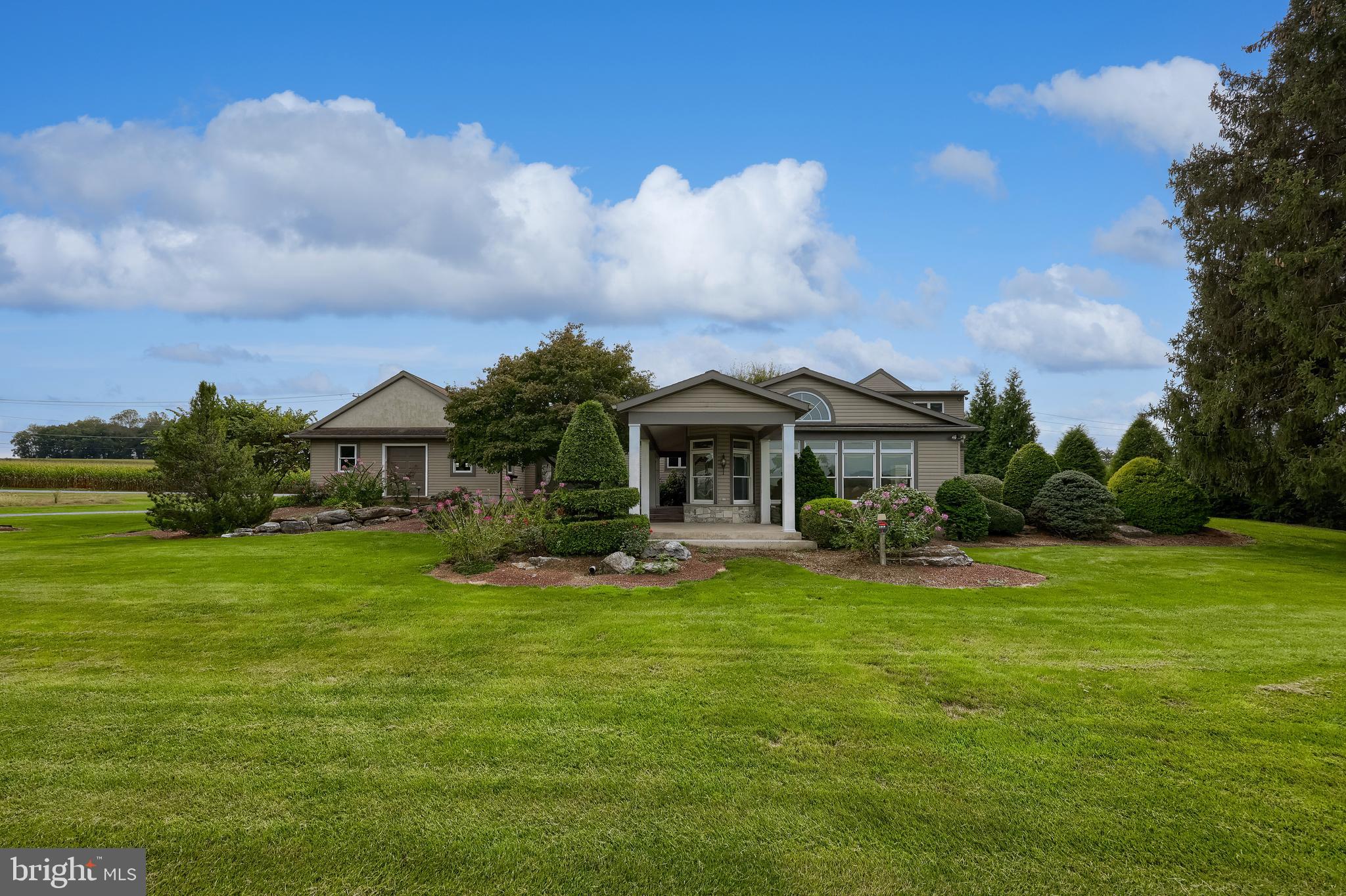 210 Stevens Road Stevens, PA 17578 - Photo 65 of 89 a front view of house with yard and green space