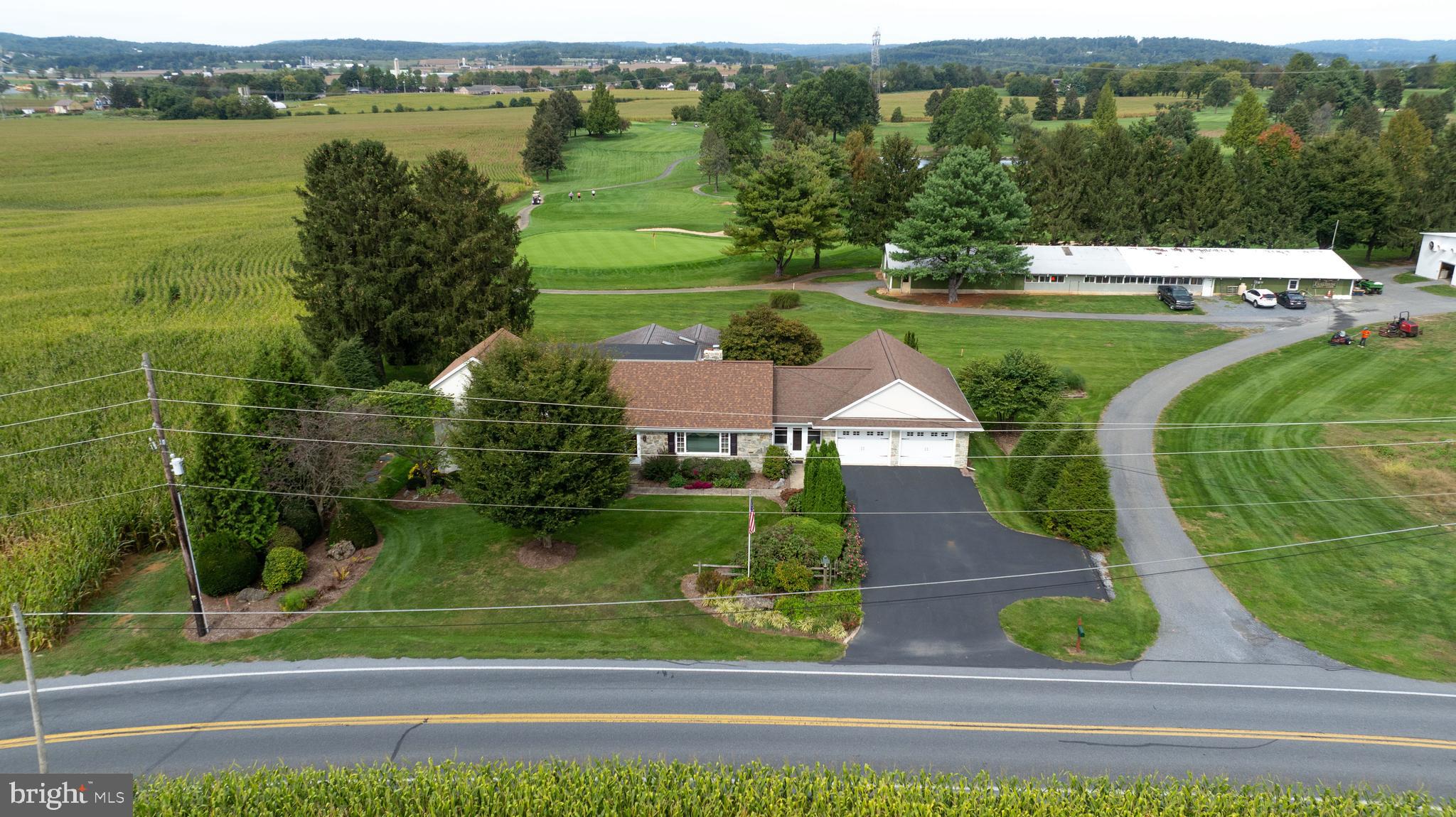 210 Stevens Road Stevens, PA 17578 - Photo 75 of 89 an aerial view of a house with a yard and lake view