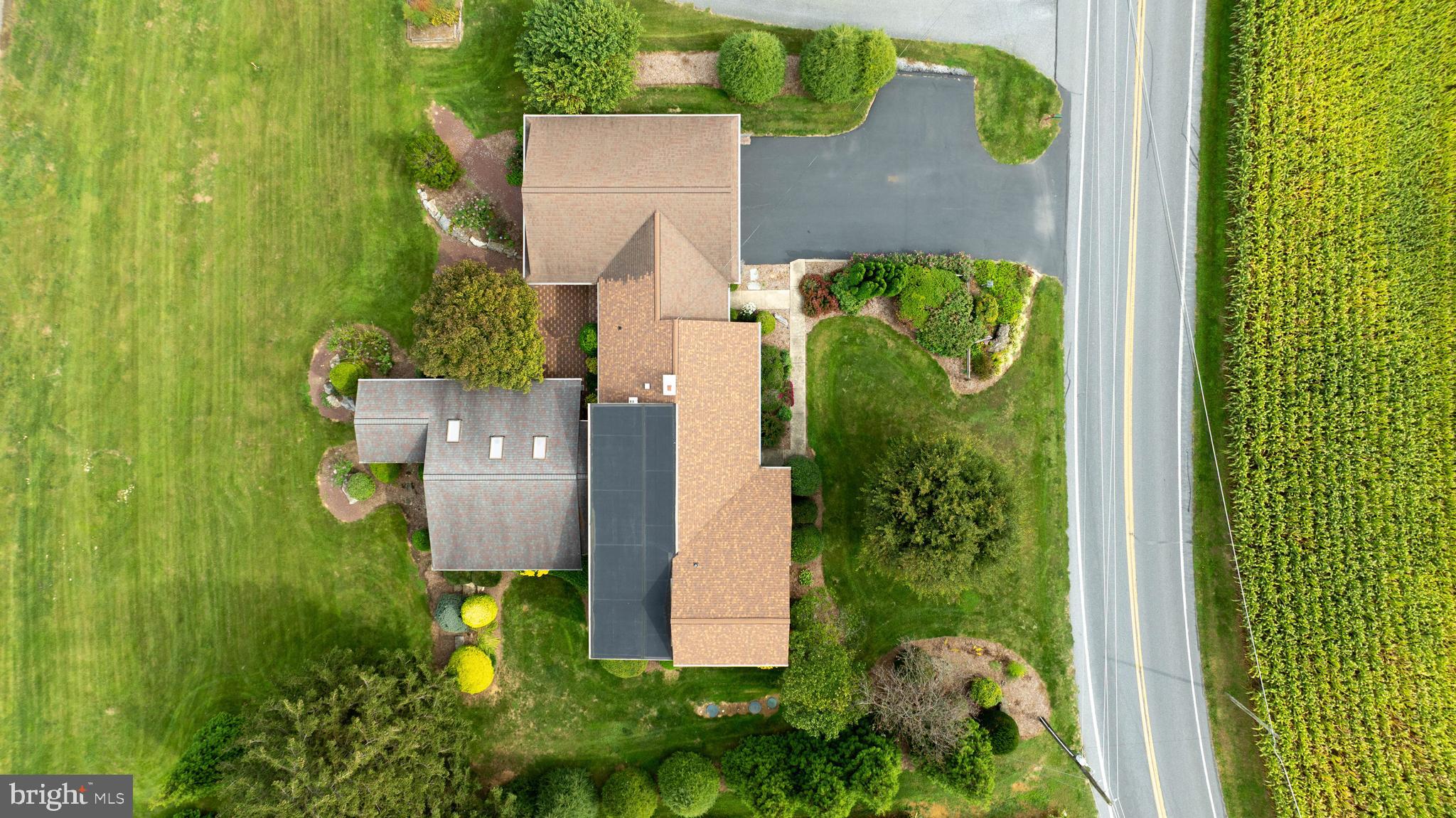 210 Stevens Road Stevens, PA 17578 - Photo 76 of 89 an aerial view of residential house with outdoor space and trees all around