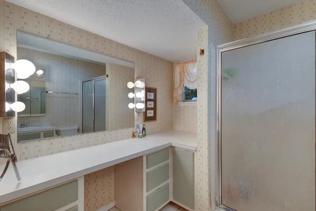 a bathroom with a sink and a mirror