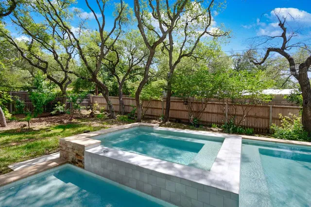 a view of a park with large trees