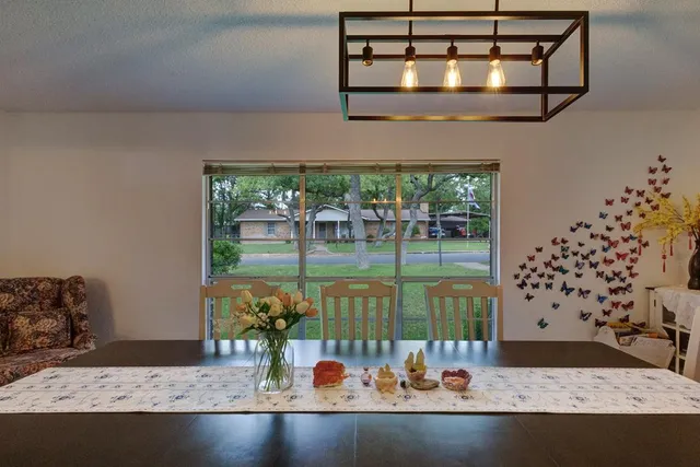 a view of a living room and chandelier