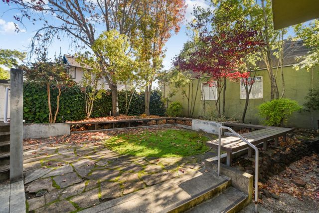 a view of a car parked in front of a building