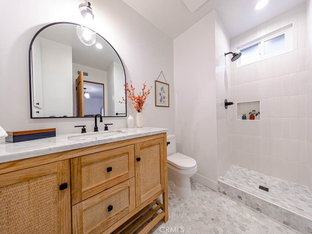 248 Crystal Lane Pasadena, CA 91103 - Photo 17 of 22 a bathroom with a double vanity sink toilet and shower