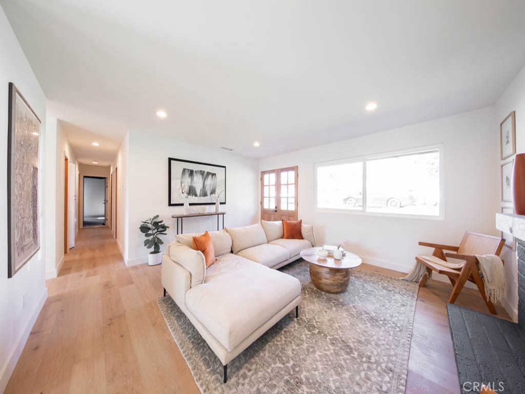 248 Crystal Lane Pasadena, CA 91103 - Photo 4 of 22 a living room with furniture a table and a window
