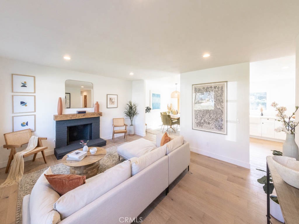 248 Crystal Lane Pasadena, CA 91103 - Photo 6 of 22 a living room with furniture a fireplace and a window