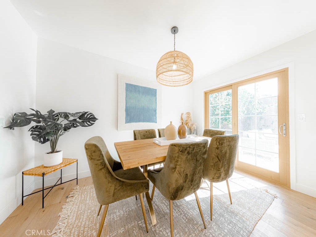 248 Crystal Lane Pasadena, CA 91103 - Photo 8 of 22 a view of a dining room with furniture window and wooden floor