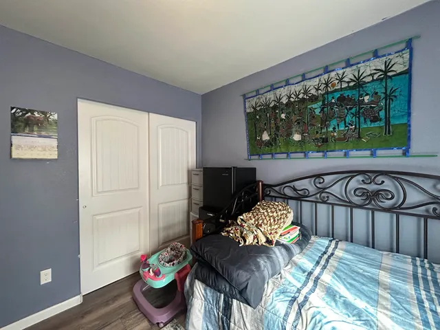 a view of a balcony furniture and floor to ceiling window