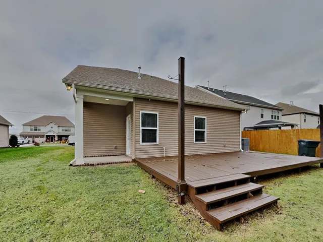 a house view with a backyard space