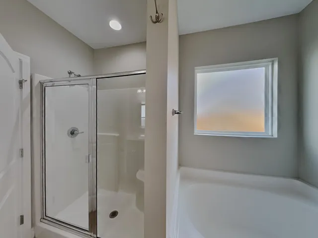 a bathroom with a glass shower door