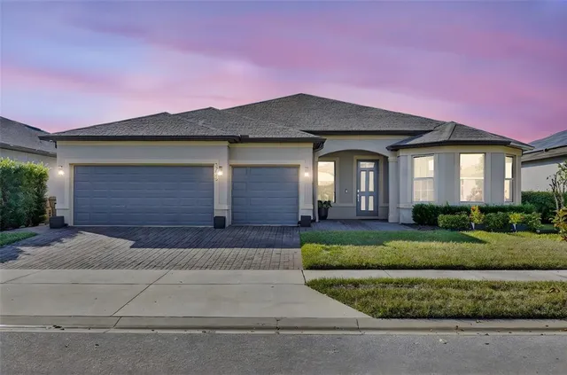 front view of a house with a yard