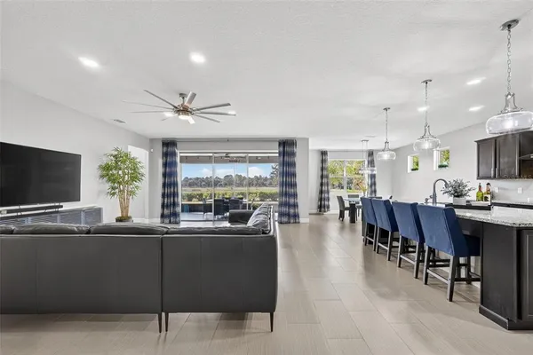 a view of a dining room with furniture and chandelier