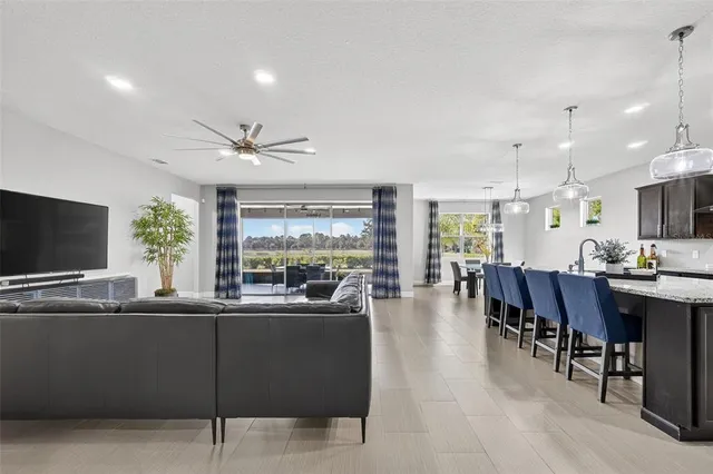 a view of a dining room with furniture and chandelier