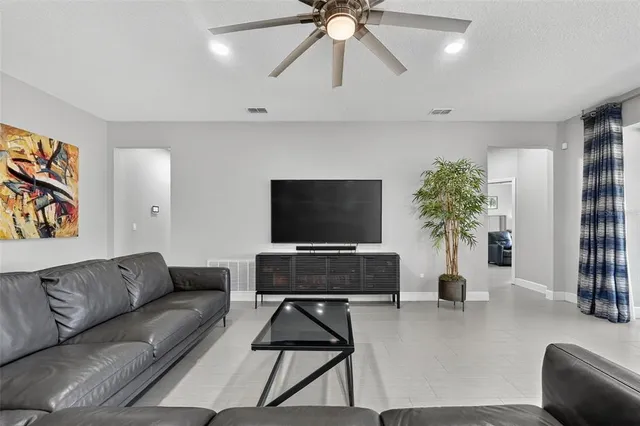 a kitchen with stainless steel appliances granite countertop a sink refrigerator and cabinets