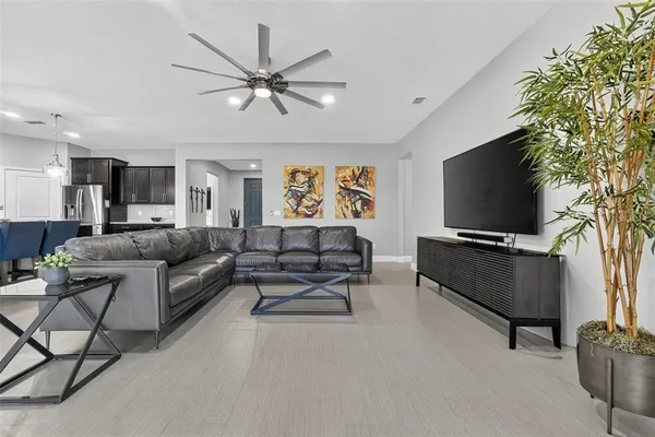 a kitchen with appliances a refrigerator and cabinets