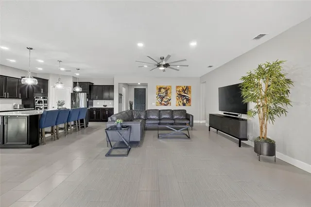 a view of a workspace with furniture and chandelier