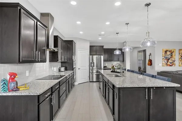 a bedroom with a bed couch and a large window