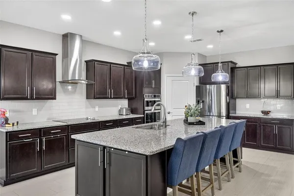 a spacious bathroom with a double vanity sink a mirror and a shower
