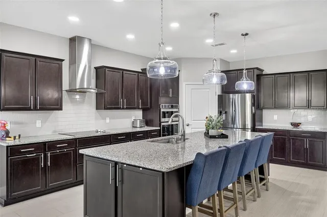 a spacious bathroom with a double vanity sink a mirror and a shower