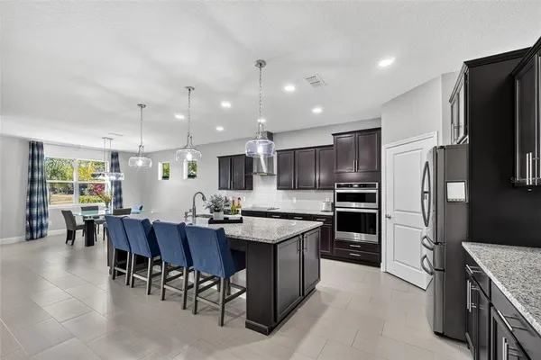 a view of walk in closet with clothes