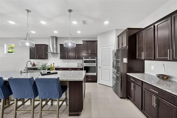 a bedroom with a bed and glass window